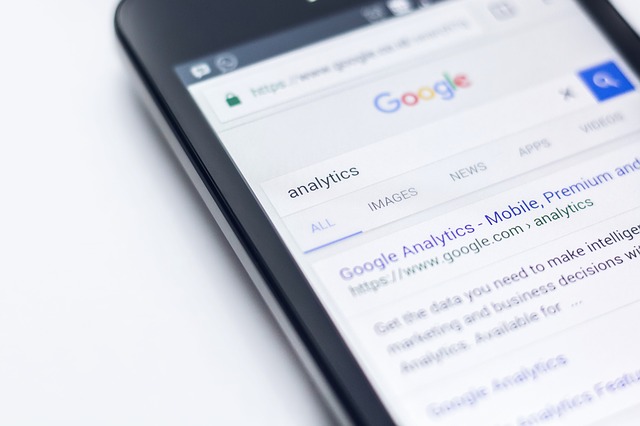Smartphone showing Google analytics on search result page