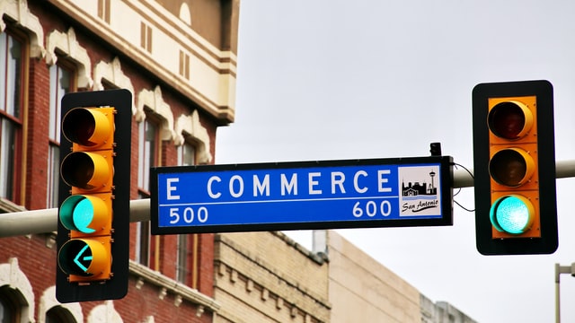 A street sign that says E Commerce