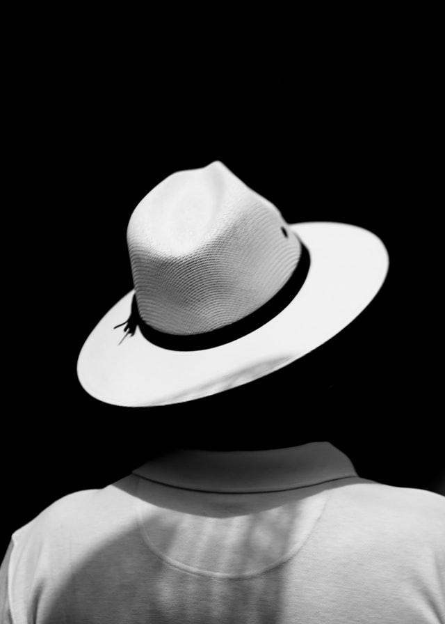 White hat on black background