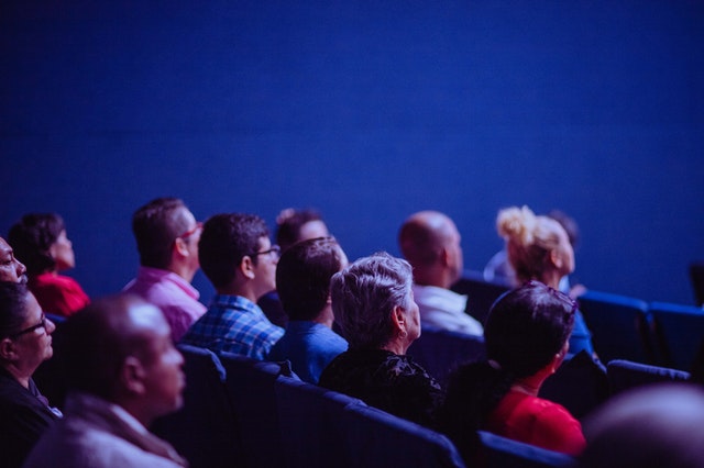Audience sitting in a theater to represent content creation strategy
