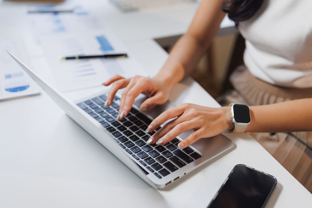 Woman typing on keyboard