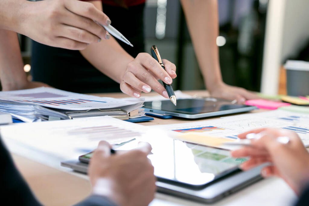 Table showing multiple computer and tablets with different charts