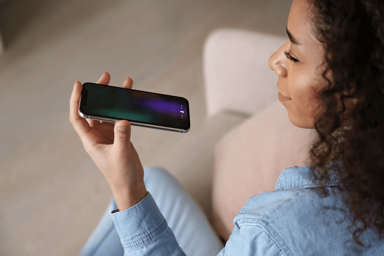 Individual holding a phone in left hand
